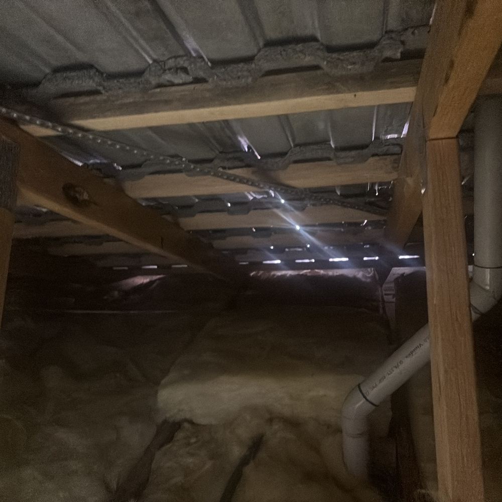 Fire resistant roof blanket missing in sections of a BAL rated roof, found during a defect investigation in Winter Valley