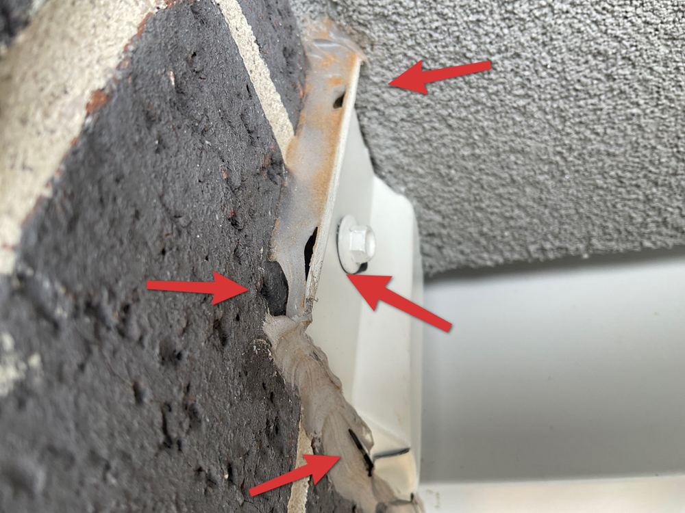 Unsealed flashing edge where water can track behind the cladding, found during a pre-handover (PCI) inspection in Bacchus Marsh