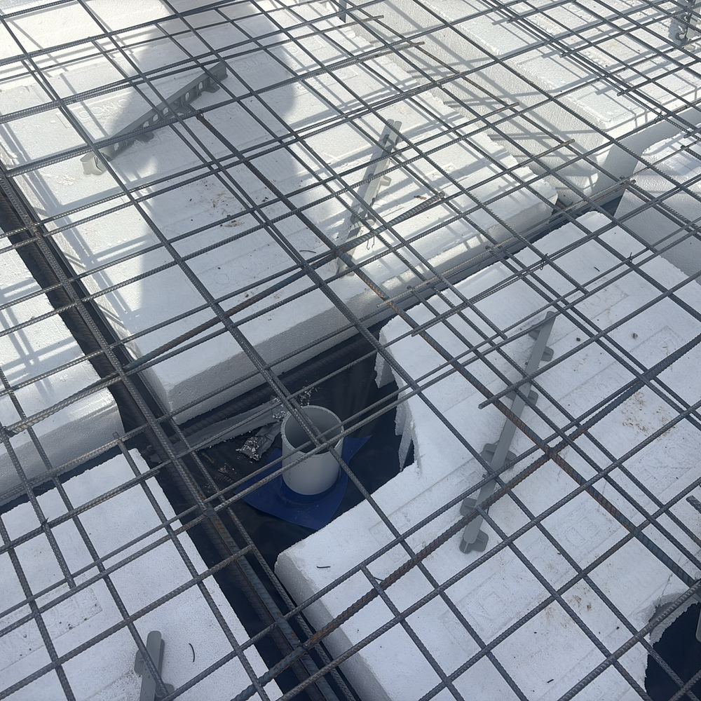 Slab mesh touching a service pipe, inside the 25mm clearance, found during a slab inspection in Maddingley